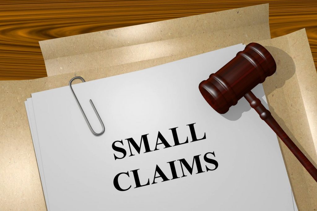 a gavel on a paper with a paper clip with legal services.