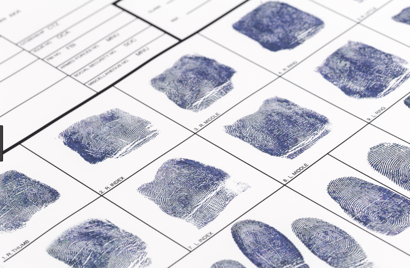 Completed FD-258 fingerprint card with clear rolled fingerprints for right and left hand.