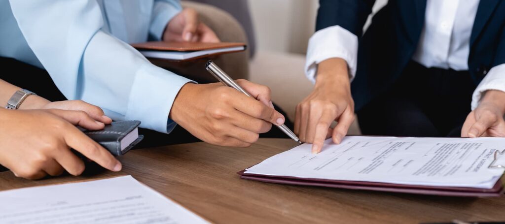 Revocable Living Trusts Notarization with a client signing legal documents under guidance during a notary session.