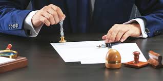 A notary is placing the stamp to the document for apostille.