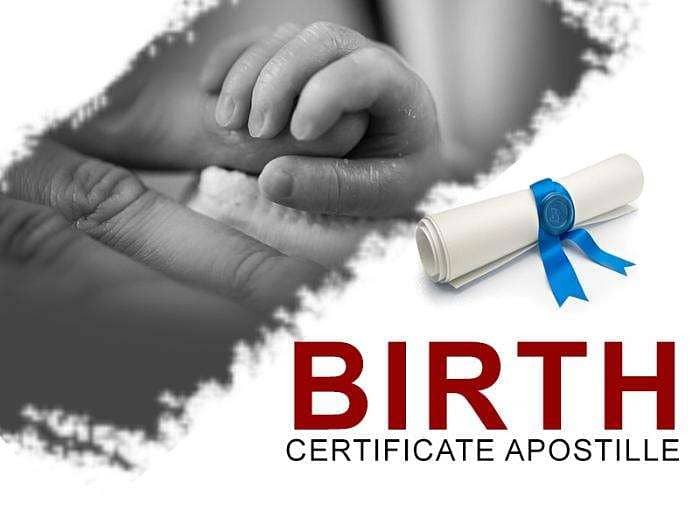 Birth certificate apostille service with baby hand and official rolled document with blue ribbon