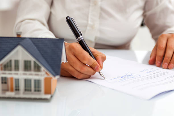 Signing documents for home purchase
