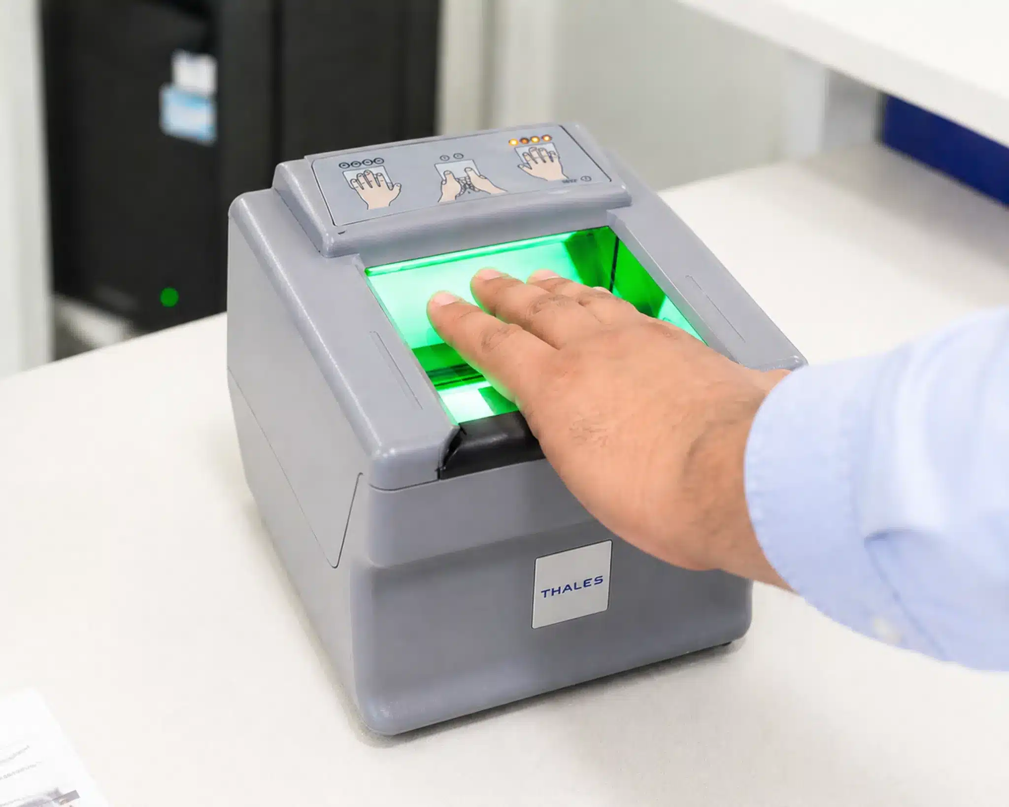 Hand placement on Live Scan fingerprint scanner during DOJ electronic fingerprinting capture in San Jose